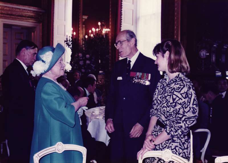Leonard Cheshire, wearing his medals and his daughter Elizabeth Cheshire at a function talking to HM The Queen Mother