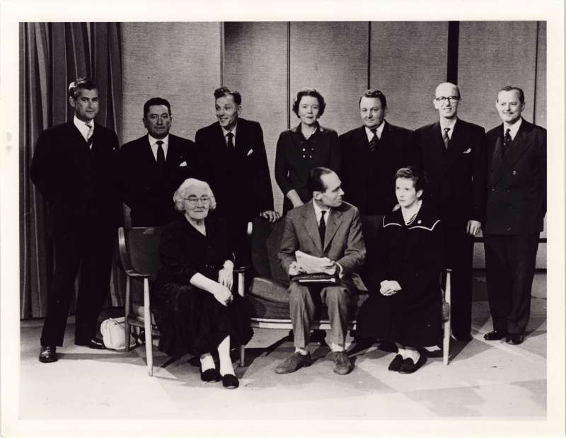 A posed group of men and women, including Leonard and Sue on the TV set of This is Your Life