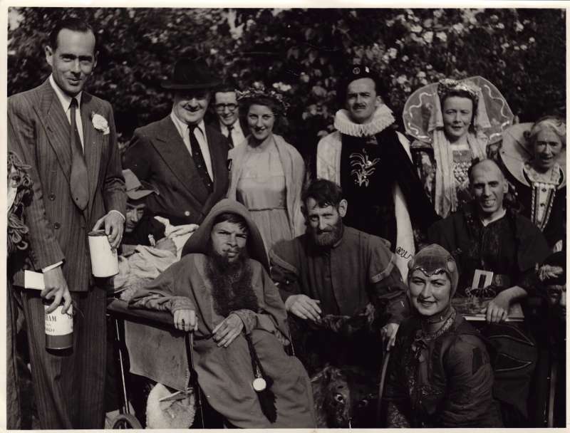 Leonard Cheshire in a posed shot with cast members from a theatre production