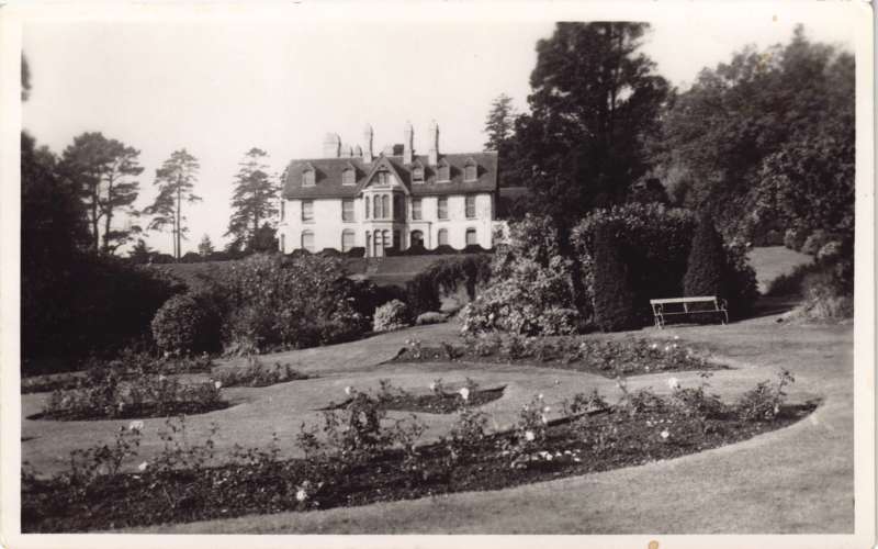 Photo showing the old Le Court house with gardens in front