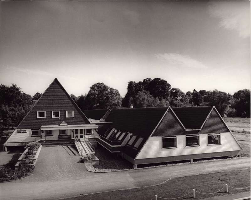 Aerial view of the Chipstead Lake building showing empty driveway and triangular buildings